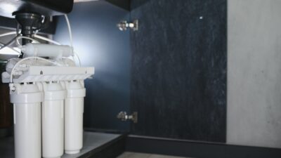 Reverse osmosis water purification system at home. Installed water purification filters. Clear water concept